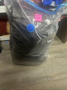 Adult coats Packed in Vacuum Storage Bag.